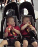 boys in twin stroller